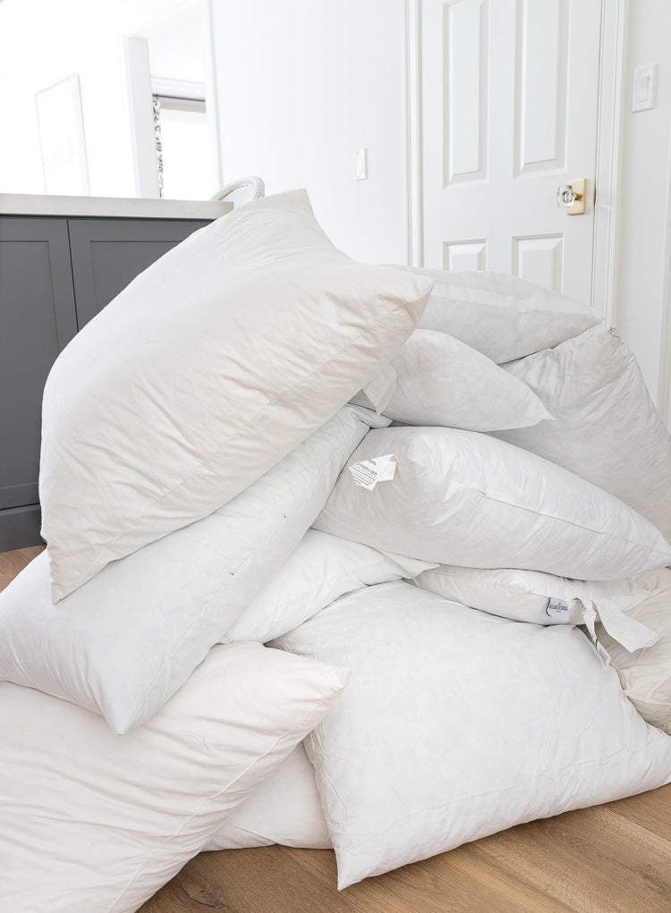 Lots of pillows piled up together